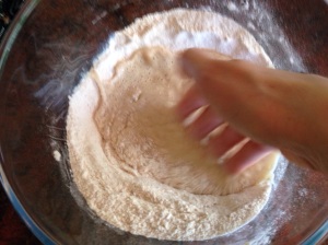Stirring liquid into flour