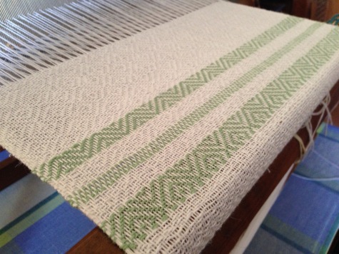 Green sample on the loom