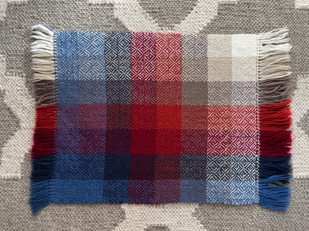 Woven colour gamp showing swatches of colour combinations in broken diamond twill.
